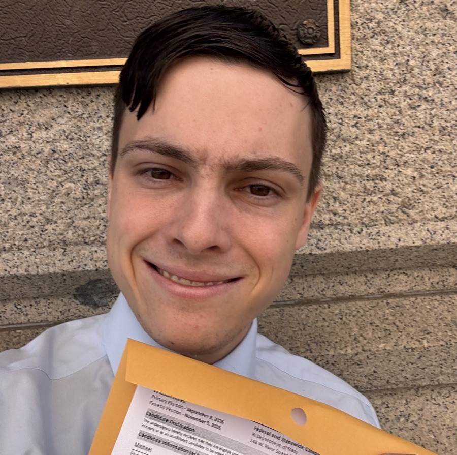 Michael holding his candidate declaration paperwork outside the Rhode Island Department of State